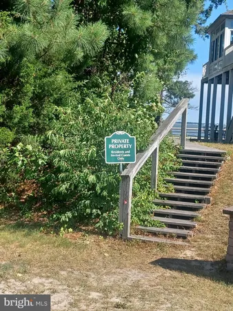 a view of a lake with sitting area