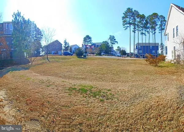 a view of a lake with a house in the background