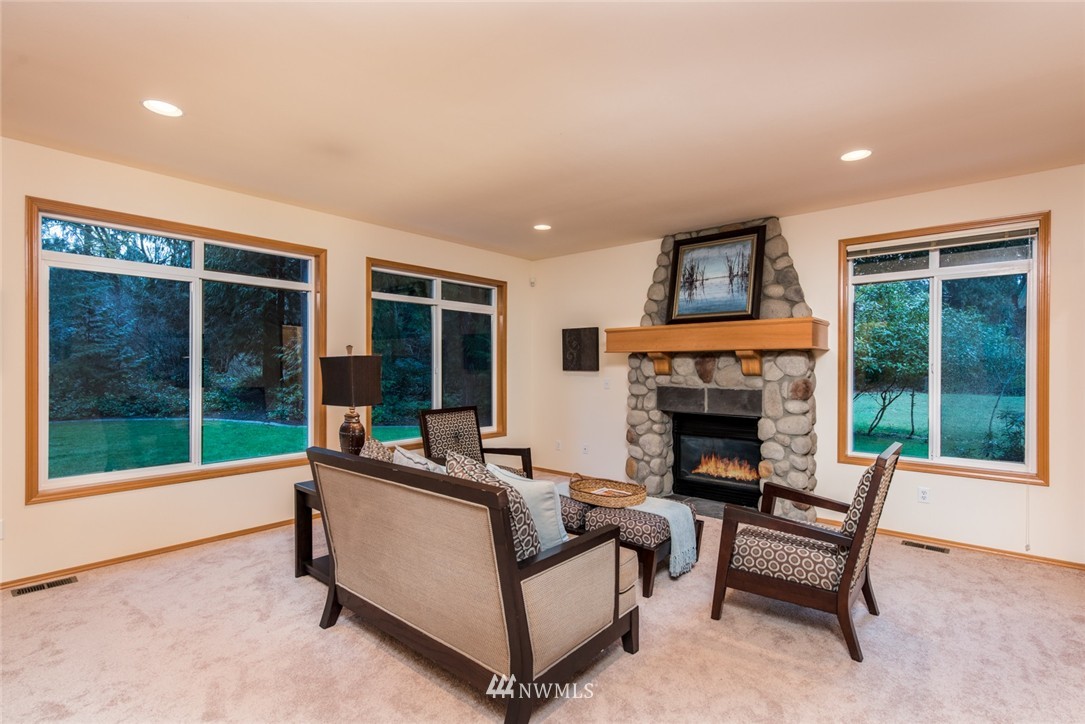 14419 152nd Place Southeast Renton, WA 98059 - Photo 14 of 25 a living room with furniture and a fireplace