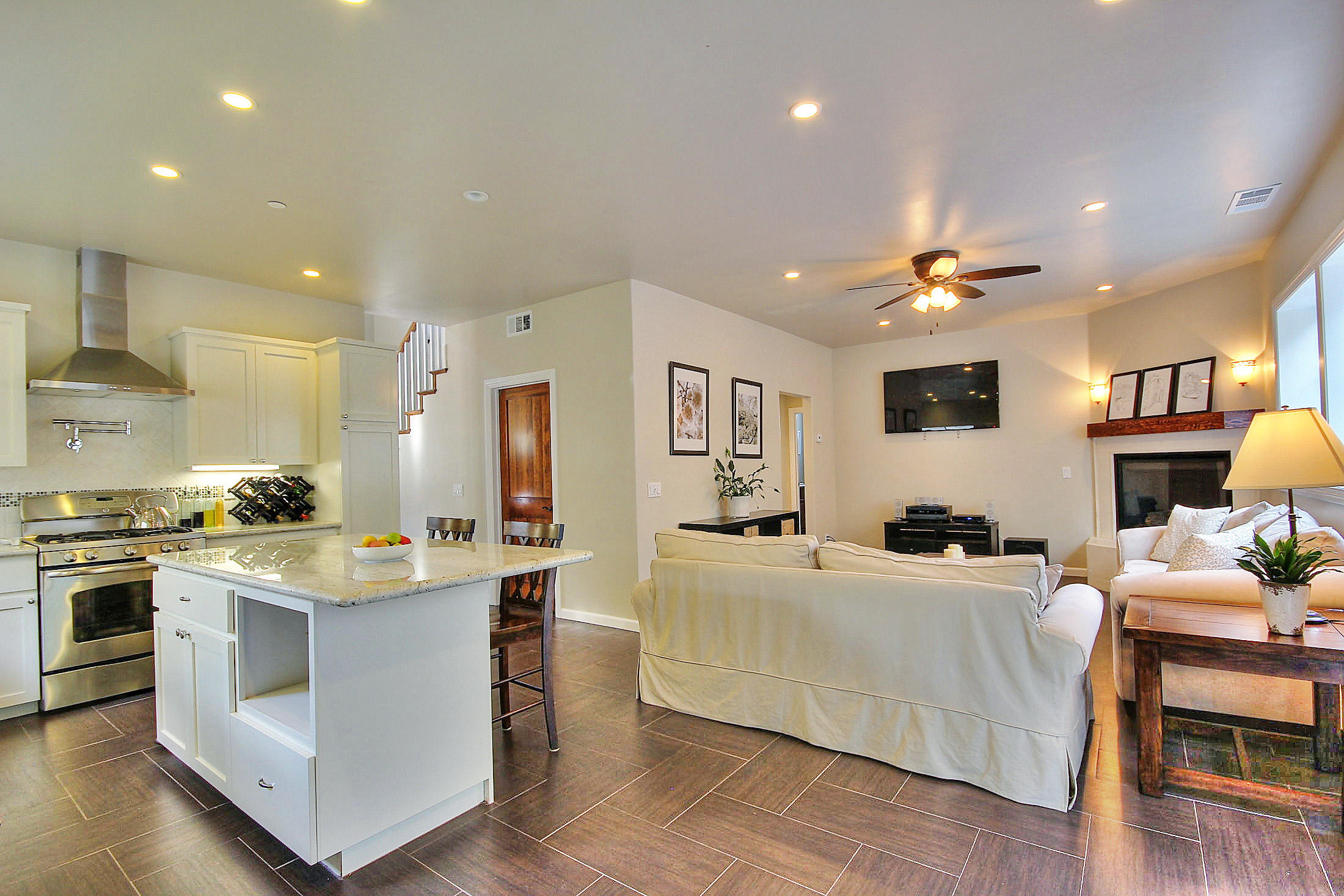 305 Sherman Road Santa Barbara, CA 93103 - Photo 9 of 23 a living room with stainless steel appliances kitchen island granite countertop furniture and a view of kitchen