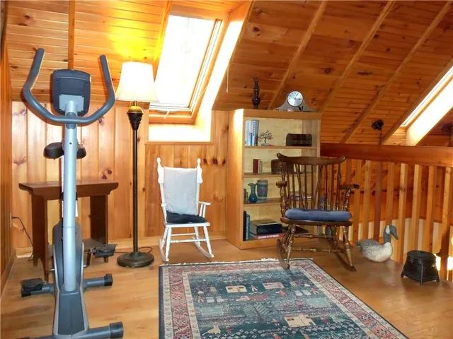 a outdoor space with lots of chairs and mirrors