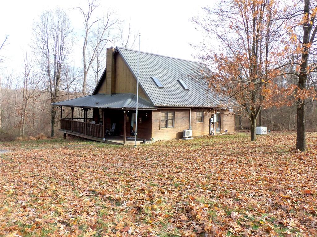 1680 Reissing Road McDonald, PA 15057 - Photo 30 of 39 a front view of a house with a yard and chandelier