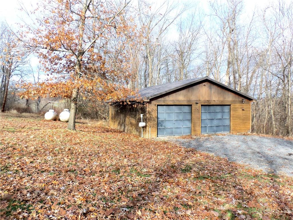 1680 Reissing Road McDonald, PA 15057 - Photo 33 of 39 a house with trees in front of it