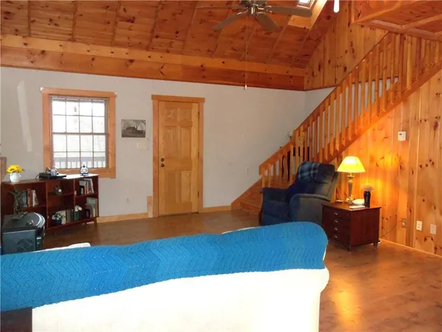 a living room with furniture and stairs