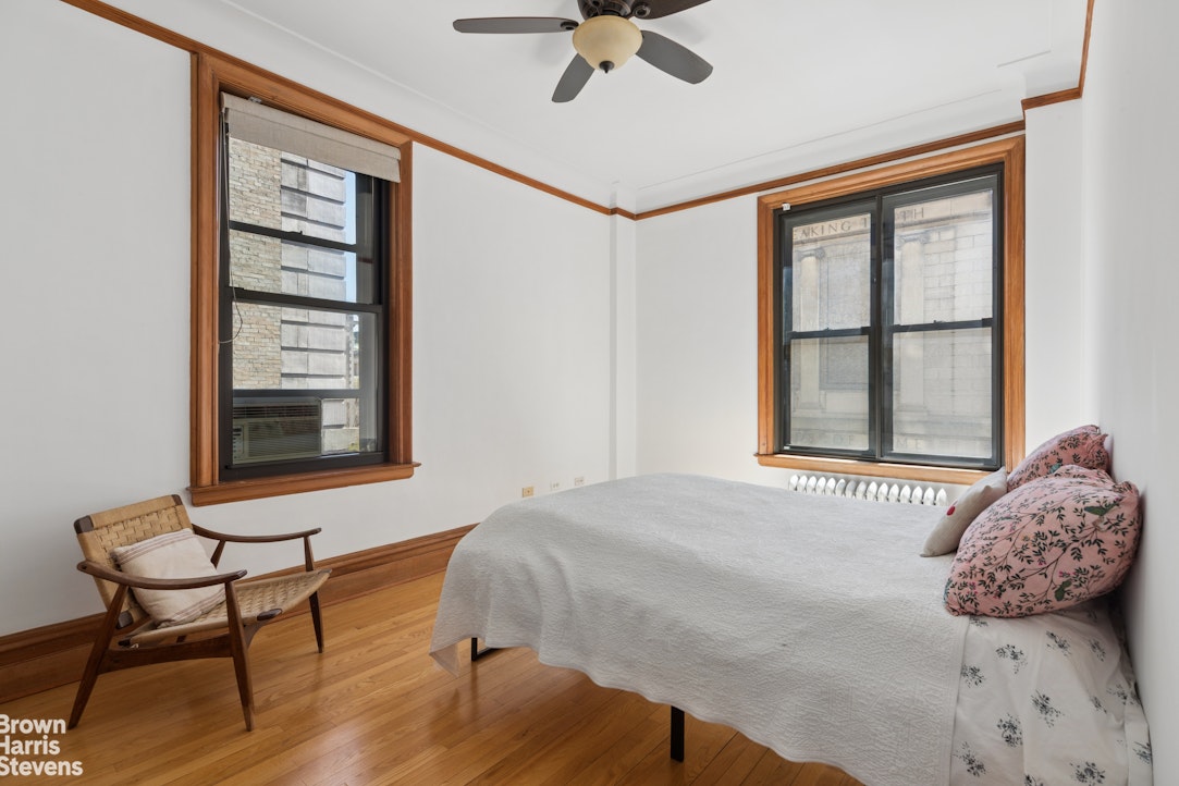 790 Riverside Drive, Unit 4J Manhattan, NY 10032 - Photo 3 of 11 a bedroom with a bed and a window