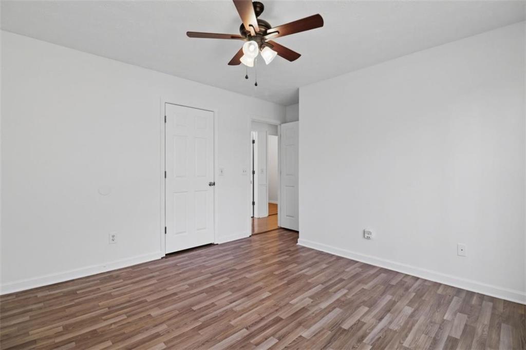 1828 4 Mile Church Road Ball Ground, GA 30107 - Photo 18 of 51 wooden floor in an empty room