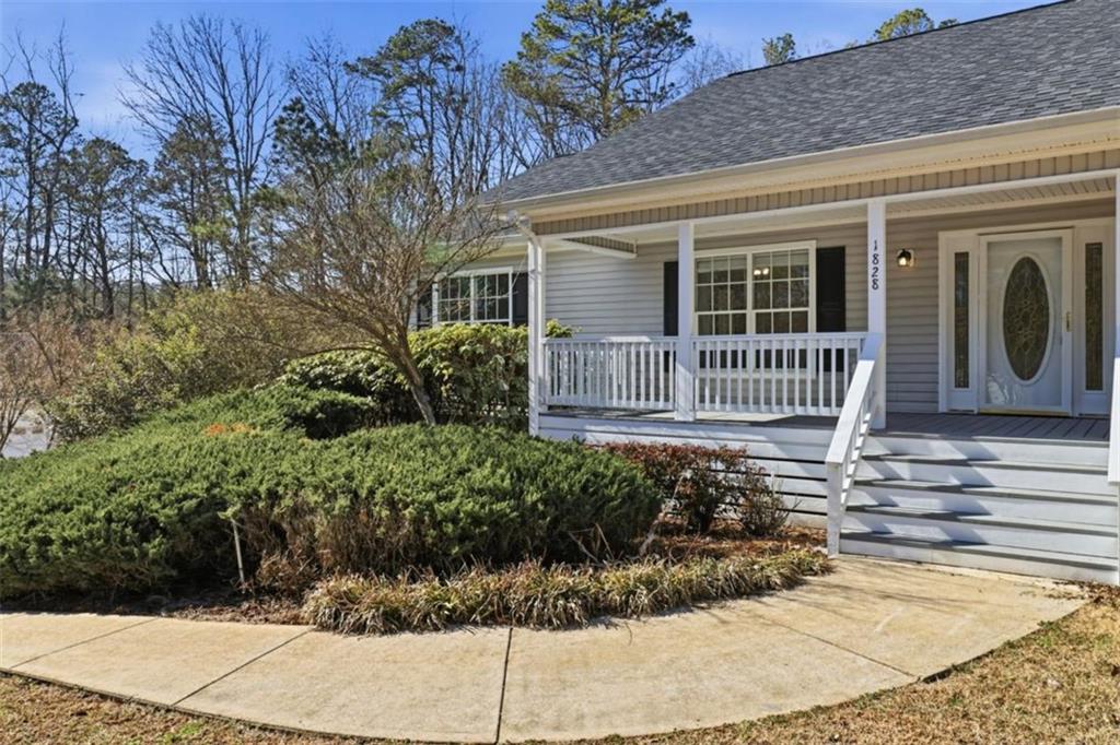 1828 4 Mile Church Road Ball Ground, GA 30107 - Photo 2 of 51 a front view of a house