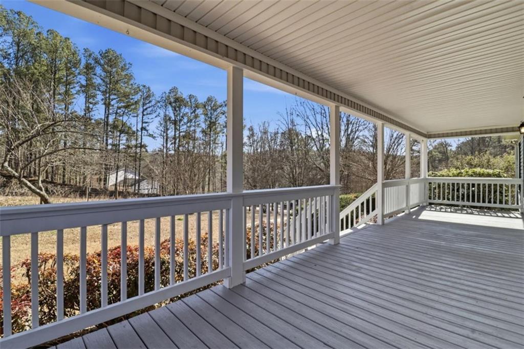 1828 4 Mile Church Road Ball Ground, GA 30107 - Photo 23 of 51 a view of a balcony with wooden floor