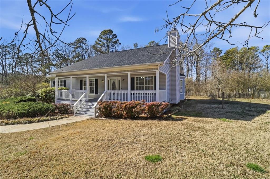 1828 4 Mile Church Road Ball Ground, GA 30107 - Photo 44 of 51 a front view of a house with a yard and garage