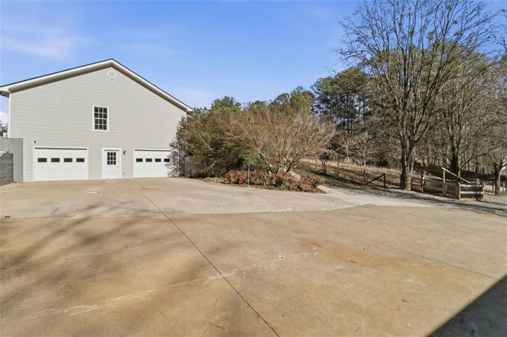 1828 4 Mile Church Road Ball Ground, GA 30107 - Photo 45 of 51 a view of the house with a snow yard