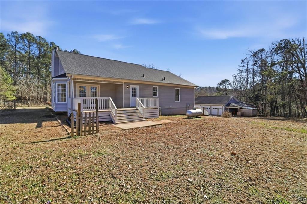 1828 4 Mile Church Road Ball Ground, GA 30107 - Photo 48 of 51 front view of a house with a yard