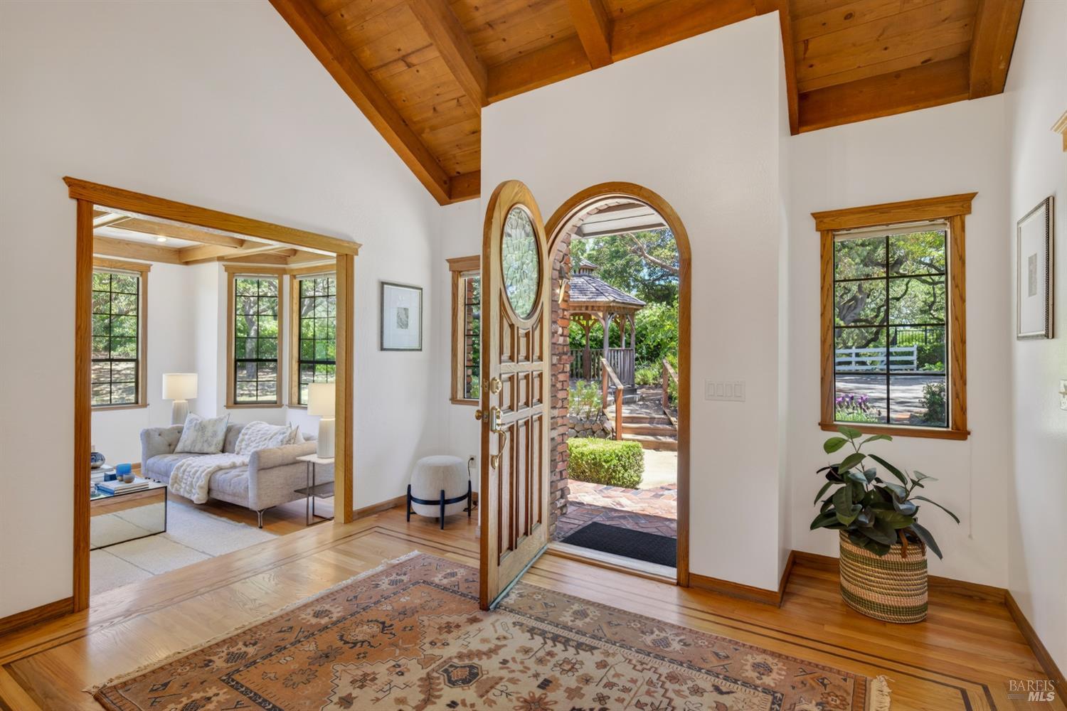 10 Lockton Lane Novato, CA 94945 - Photo 6 of 68 Light-filled entry area with arched architectural details, wood floors, and a refined sense of arrival.