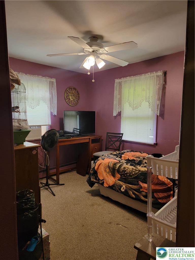 320 Hillside Street Forest City, PA 18421 - Photo 14 of 24 a bedroom with furniture and a window