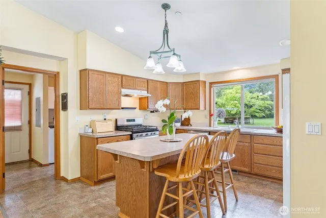a view of a dining room with furniture window and outside view