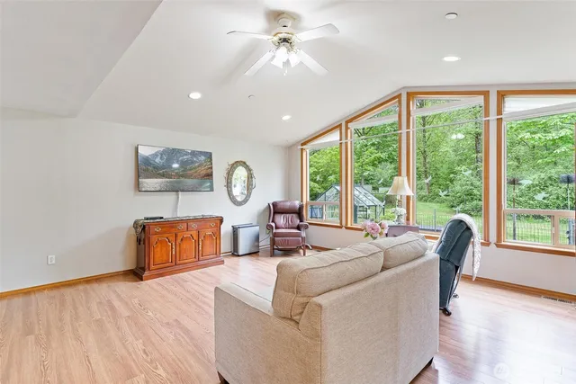 a living room with furniture and a large window