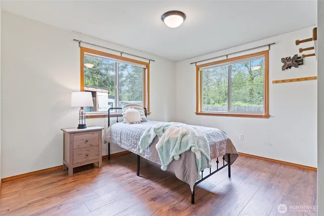 a bedroom with a bed and window