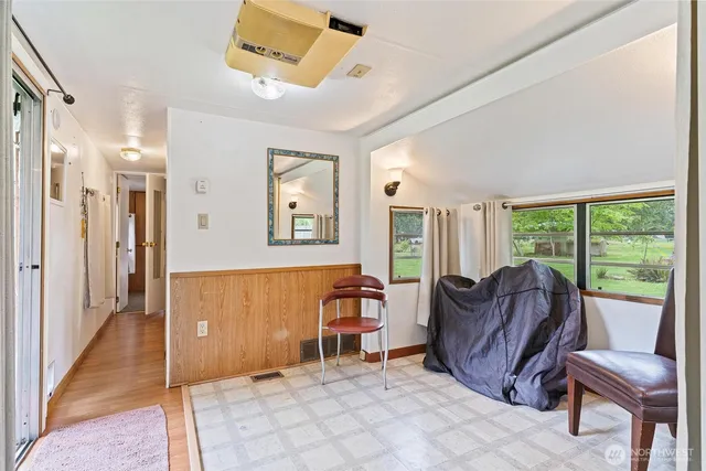 a view of a livingroom with furniture and windows