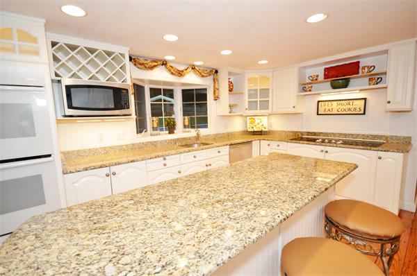 8 Bayberry Road Acton, MA 01720 - Photo 11 of 22 a bathroom with a granite countertop sink and a large mirror