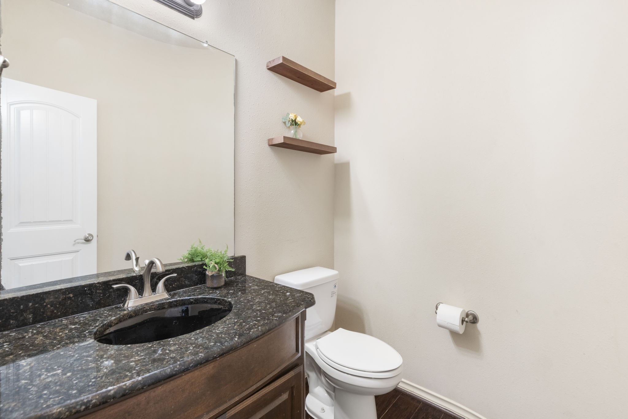 19819 Iceland Court Spring, TX 77379 - Photo 30 of 42 Main-floor powder room/half bath with vanity space.