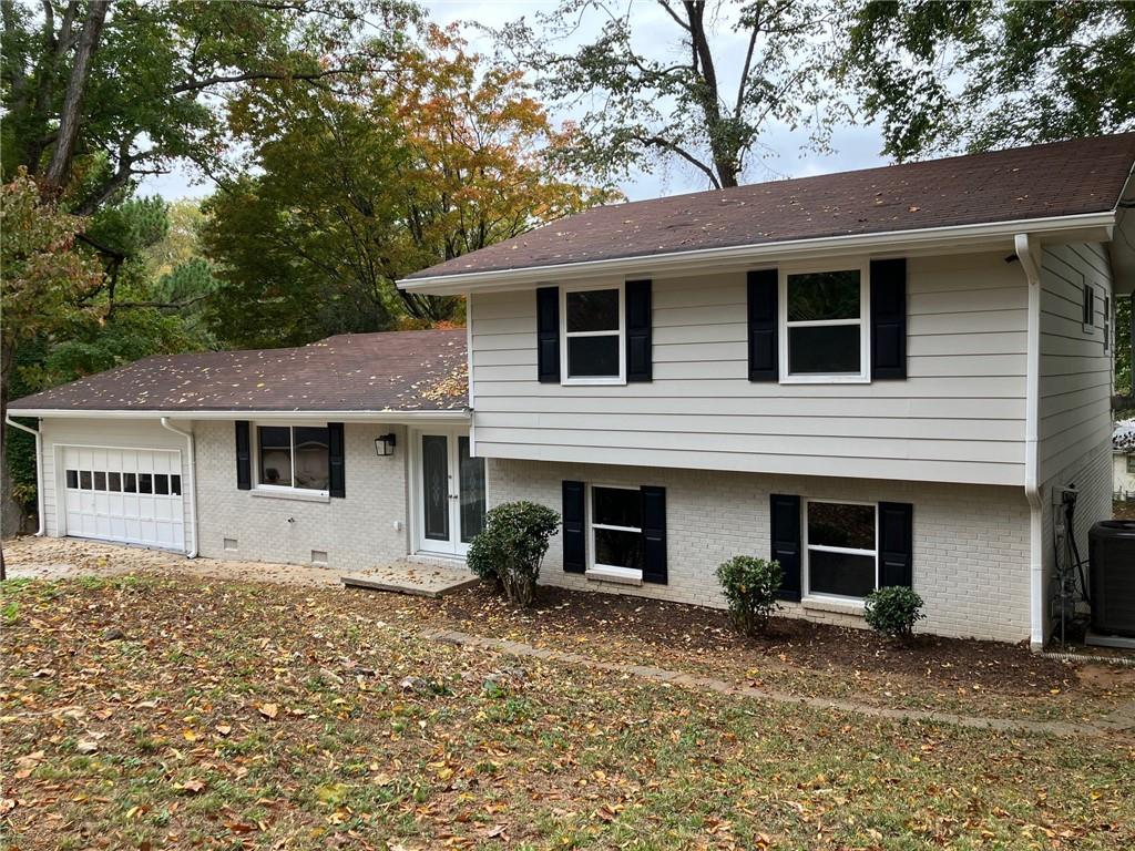 3666 Elkridge Drive Decatur, GA 30032 - Photo 1 of 1 a front view of a house with a yard