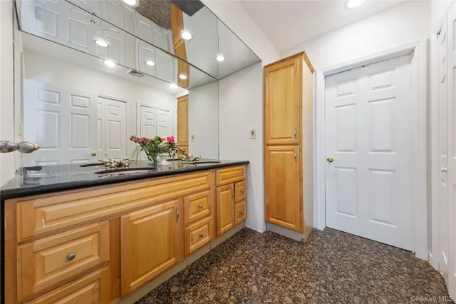 a bathroom with a bathtub a sink and a shower