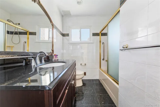 a view of entryway with wooden floor and stairs