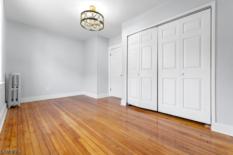 3202 Tremley Point Road Linden, NJ 07036 - Photo 14 of 41 a view of an empty room with wooden floor