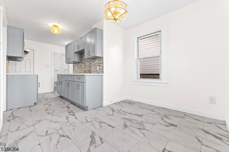 3202 Tremley Point Road Linden, NJ 07036 - Photo 20 of 41 a view of kitchen and hall with wooden floor