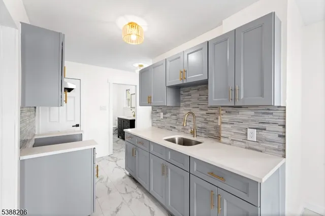 a kitchen with a sink and cabinets