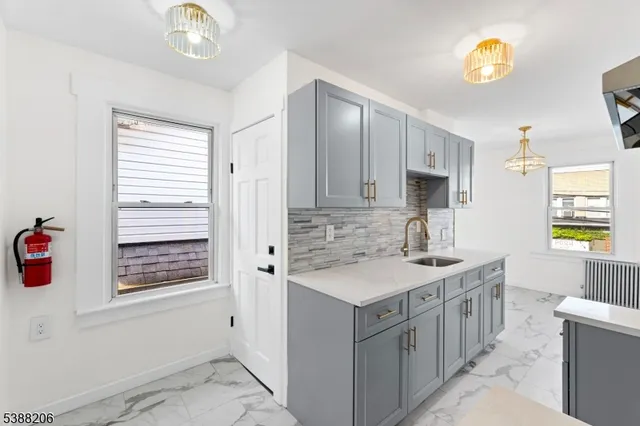 a bathroom with a sink a vanity and a mirror