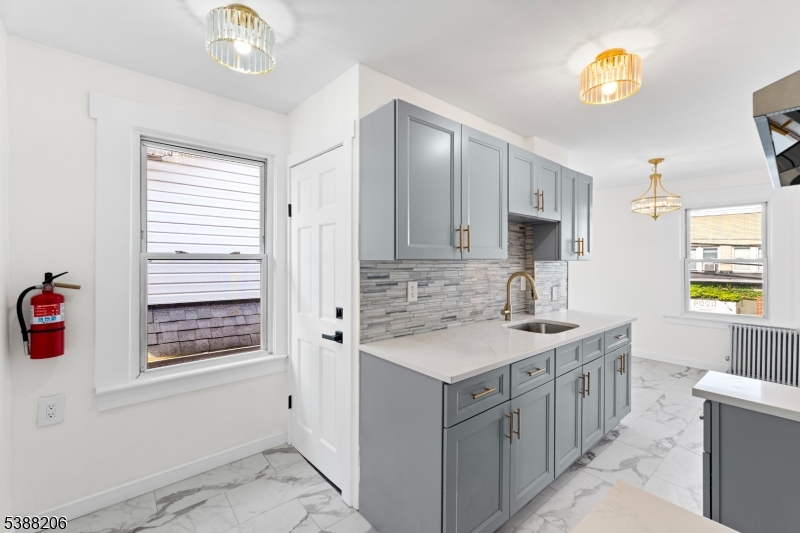 3202 Tremley Point Road Linden, NJ 07036 - Photo 23 of 41 a bathroom with a sink a vanity and a mirror