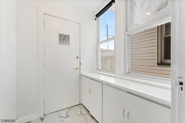 a view of a window and cabinets