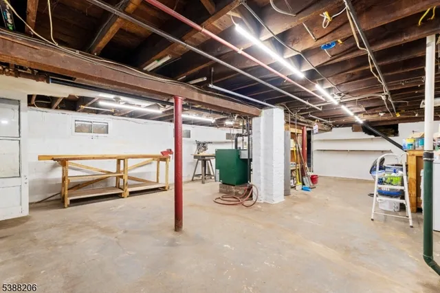 a view of a garage with wooden table and chairs
