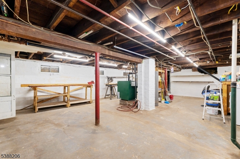 3202 Tremley Point Road Linden, NJ 07036 - Photo 37 of 41 a view of a garage with wooden table and chairs