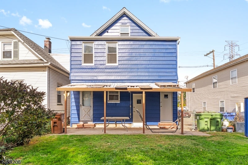 3202 Tremley Point Road Linden, NJ 07036 - Photo 40 of 41 a view of a house with a yard and sitting area