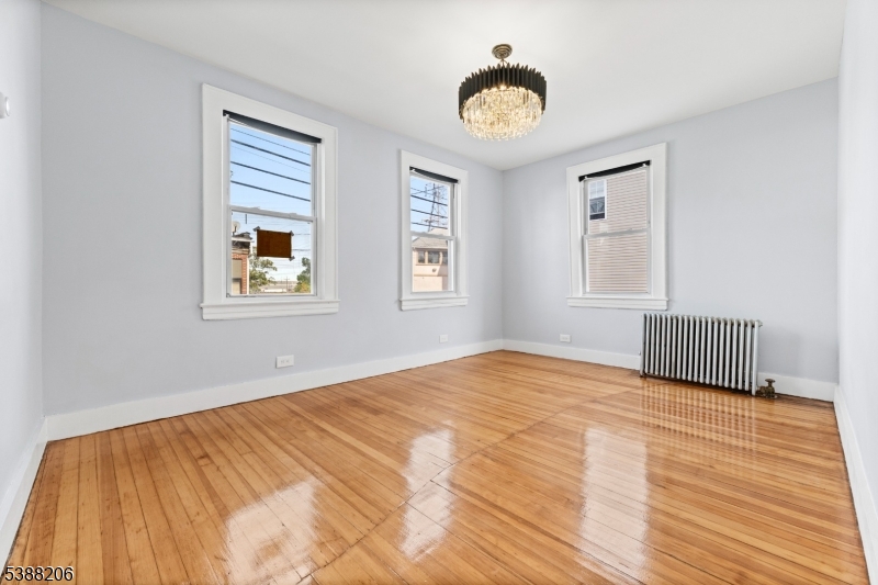 3202 Tremley Point Road Linden, NJ 07036 - Photo 10 of 41 a bedroom with a bed and a window