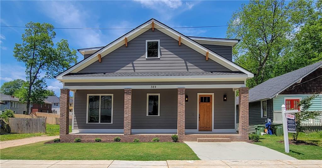 389 Hopkins Street Southwest Atlanta, GA 30310 - Photo 1 of 1 a front view of a house with garden