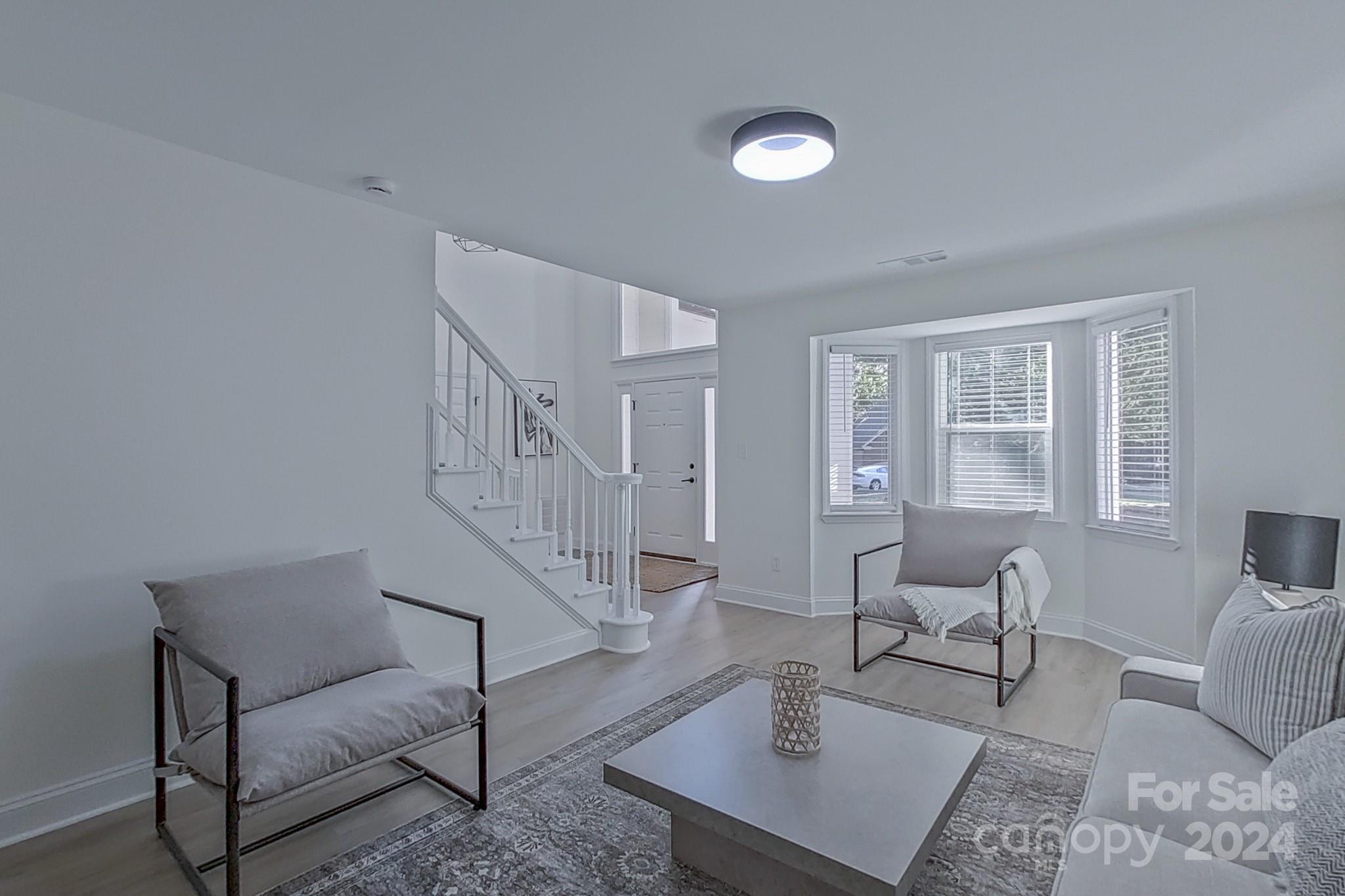 5710 Stream Ridge Drive Charlotte, NC 28269 - Photo 12 of 48 a living room with furniture and a table