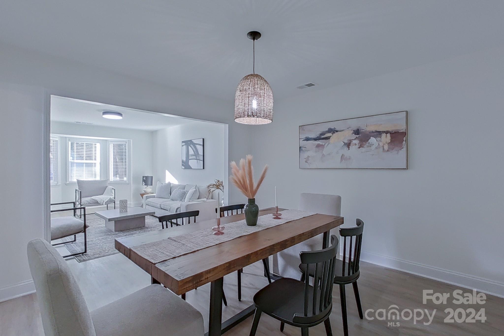 5710 Stream Ridge Drive Charlotte, NC 28269 - Photo 13 of 48 a view of a dining room with furniture and wooden floor