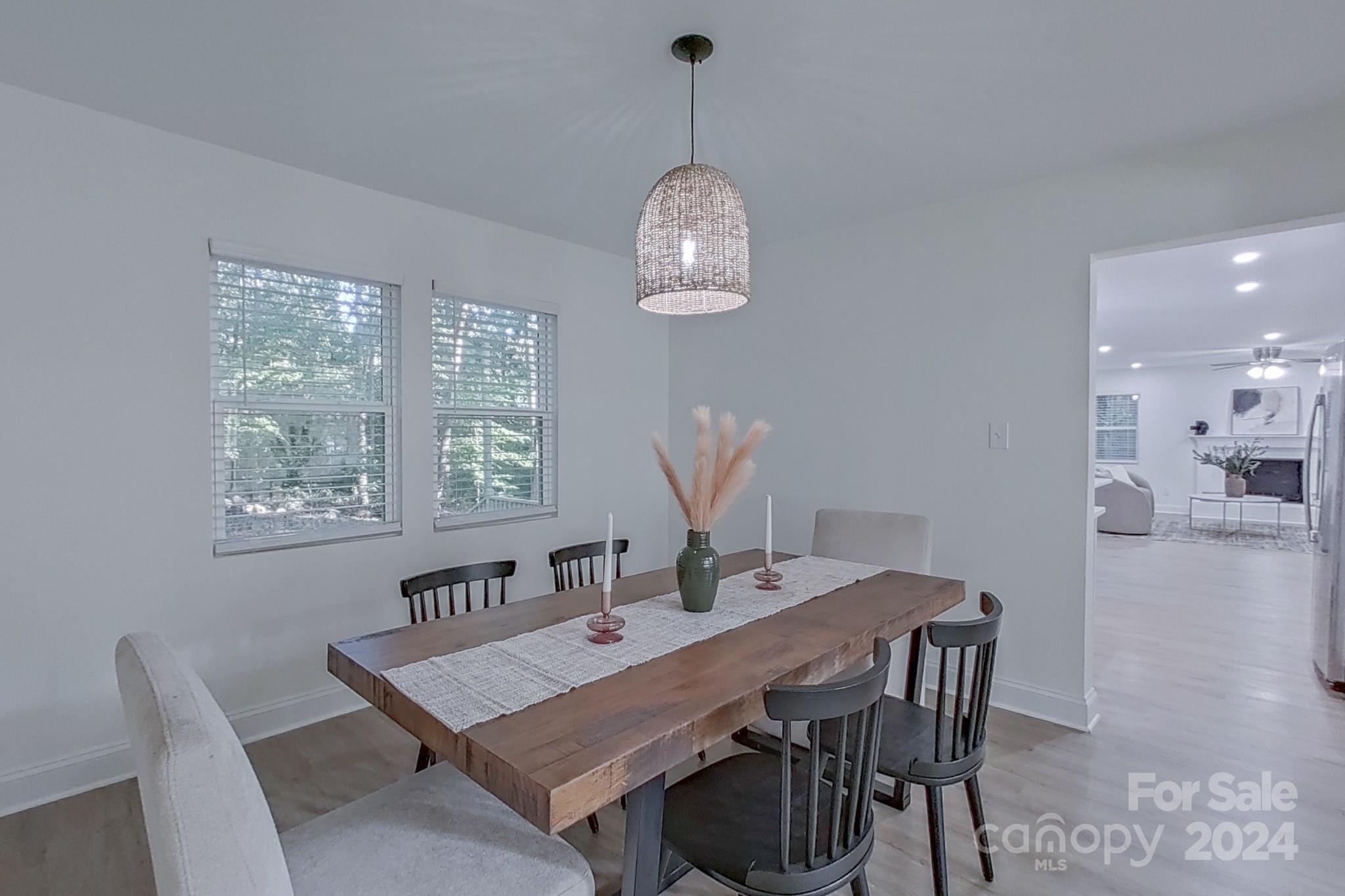 5710 Stream Ridge Drive Charlotte, NC 28269 - Photo 14 of 48 a view of a dining room with a table and chairs
