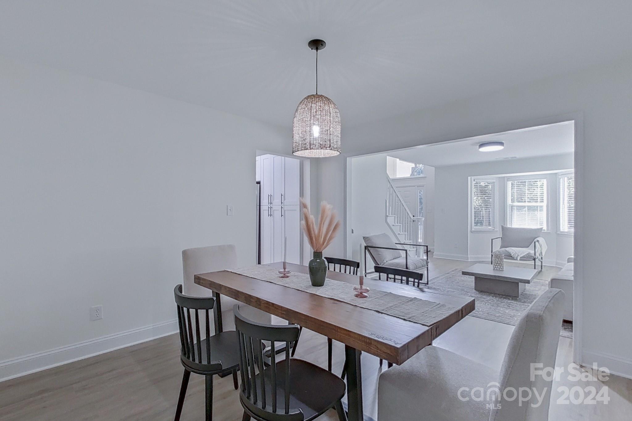 5710 Stream Ridge Drive Charlotte, NC 28269 - Photo 15 of 48 a view of a dining room with a table and chairs