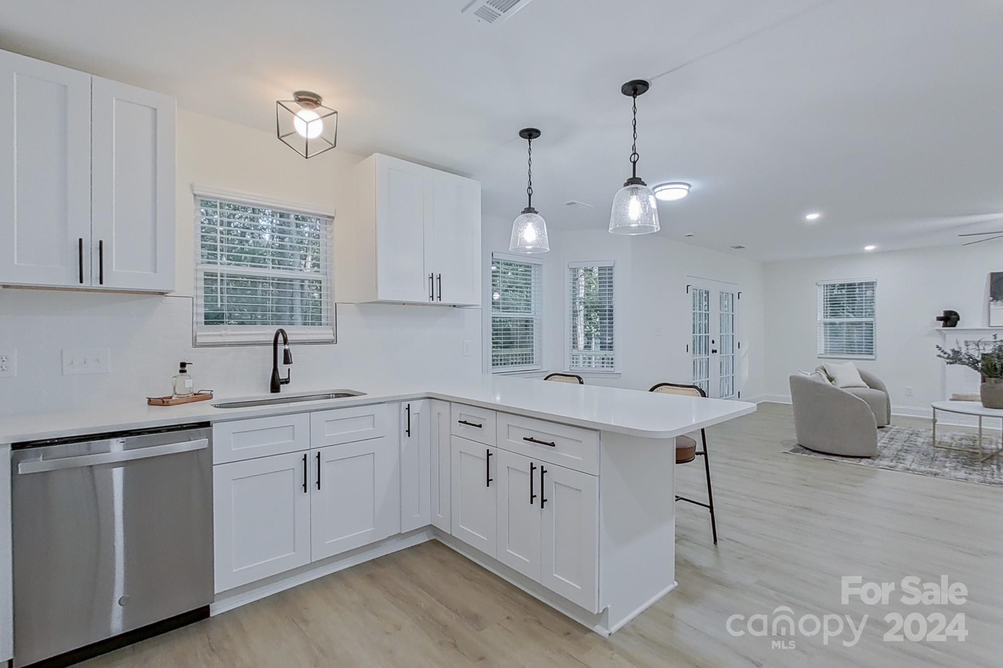 5710 Stream Ridge Drive Charlotte, NC 28269 - Photo 18 of 48 a kitchen with sink and cabinets