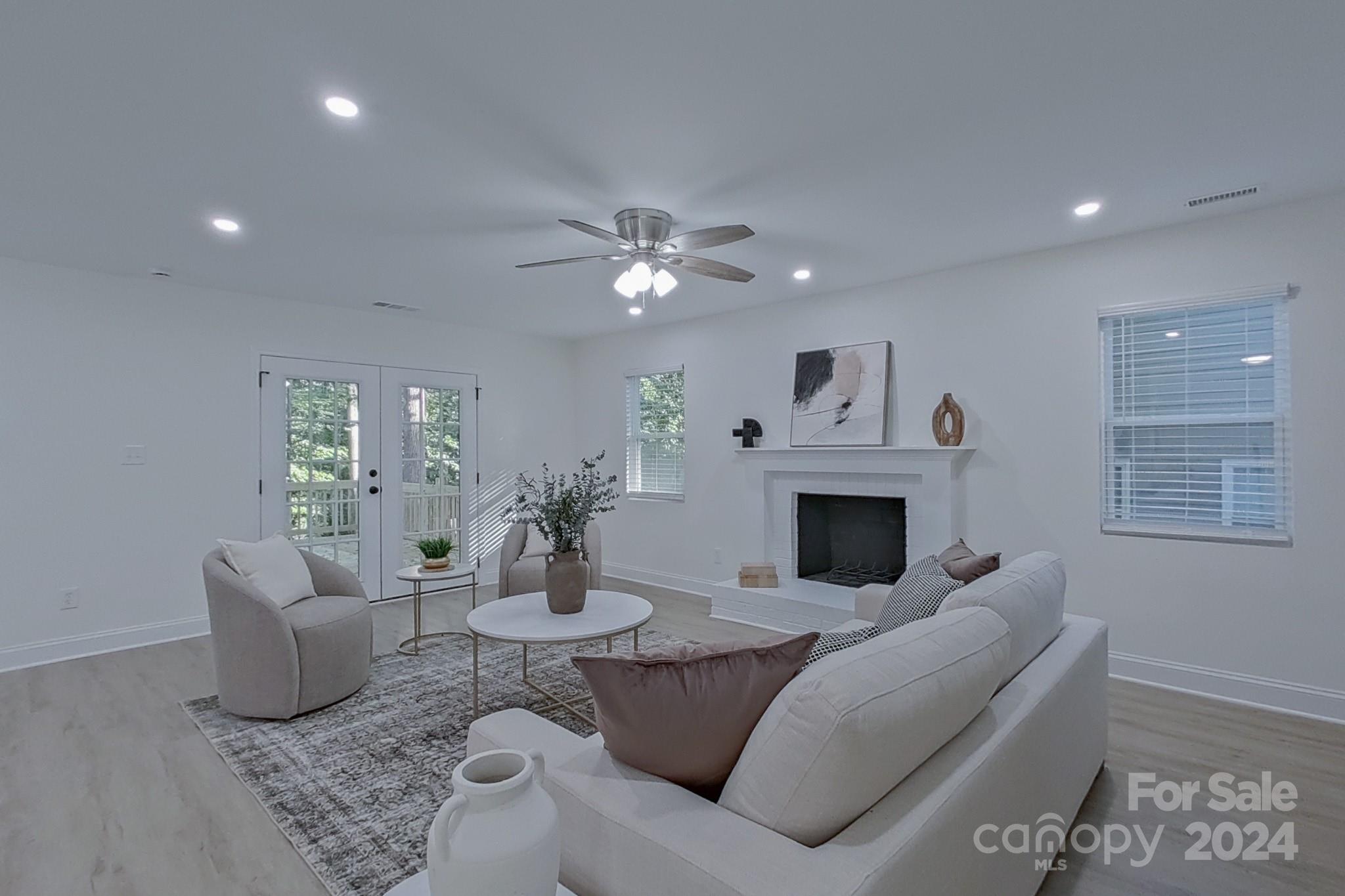 5710 Stream Ridge Drive Charlotte, NC 28269 - Photo 23 of 48 a living room with furniture and a fireplace