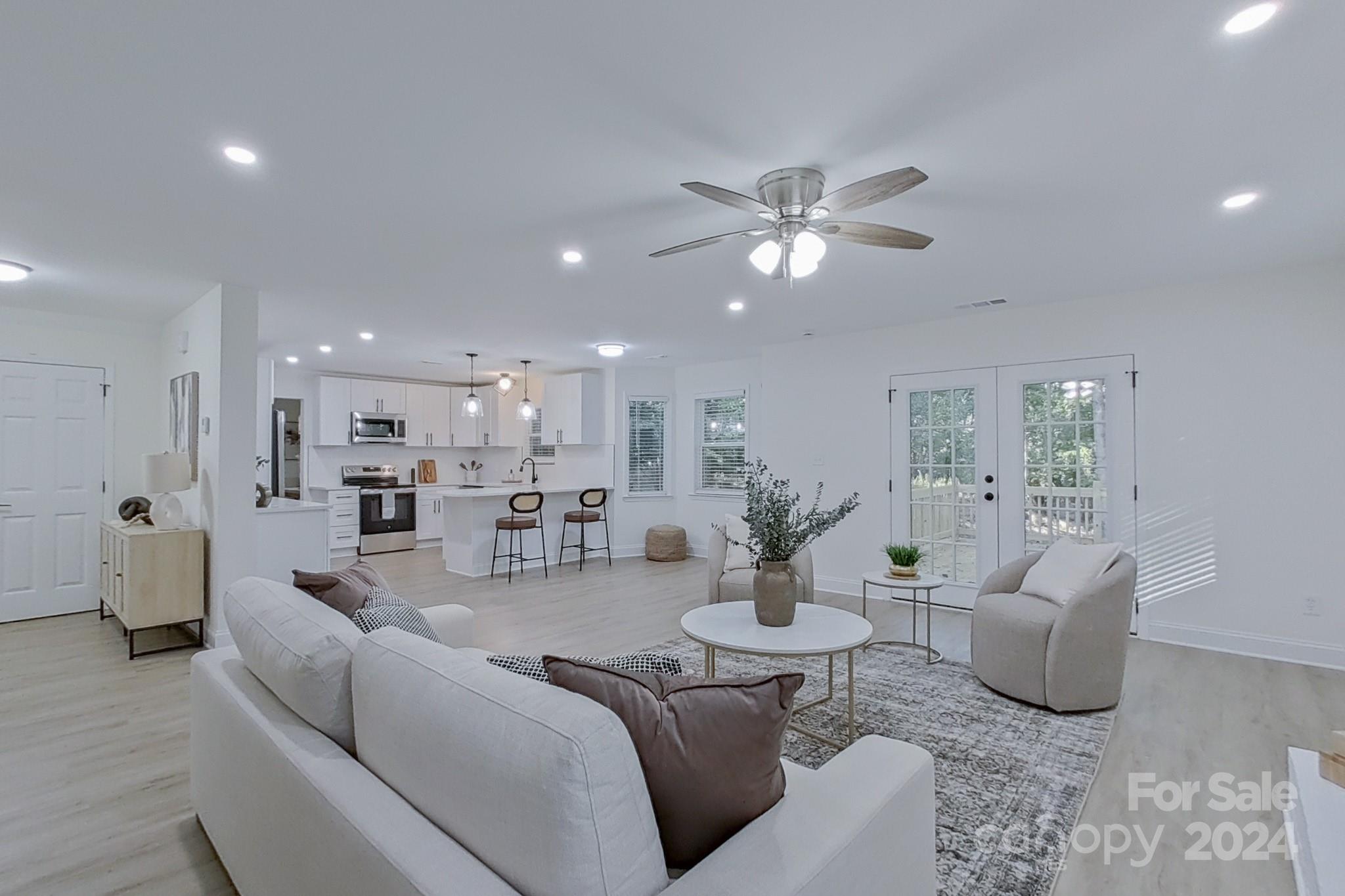 5710 Stream Ridge Drive Charlotte, NC 28269 - Photo 26 of 48 a living room with furniture and kitchen view