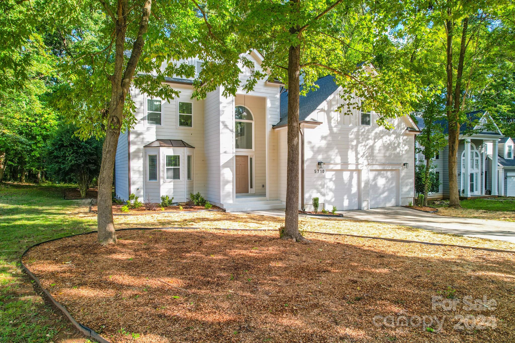 5710 Stream Ridge Drive Charlotte, NC 28269 - Photo 3 of 48 a view of a house with a yard
