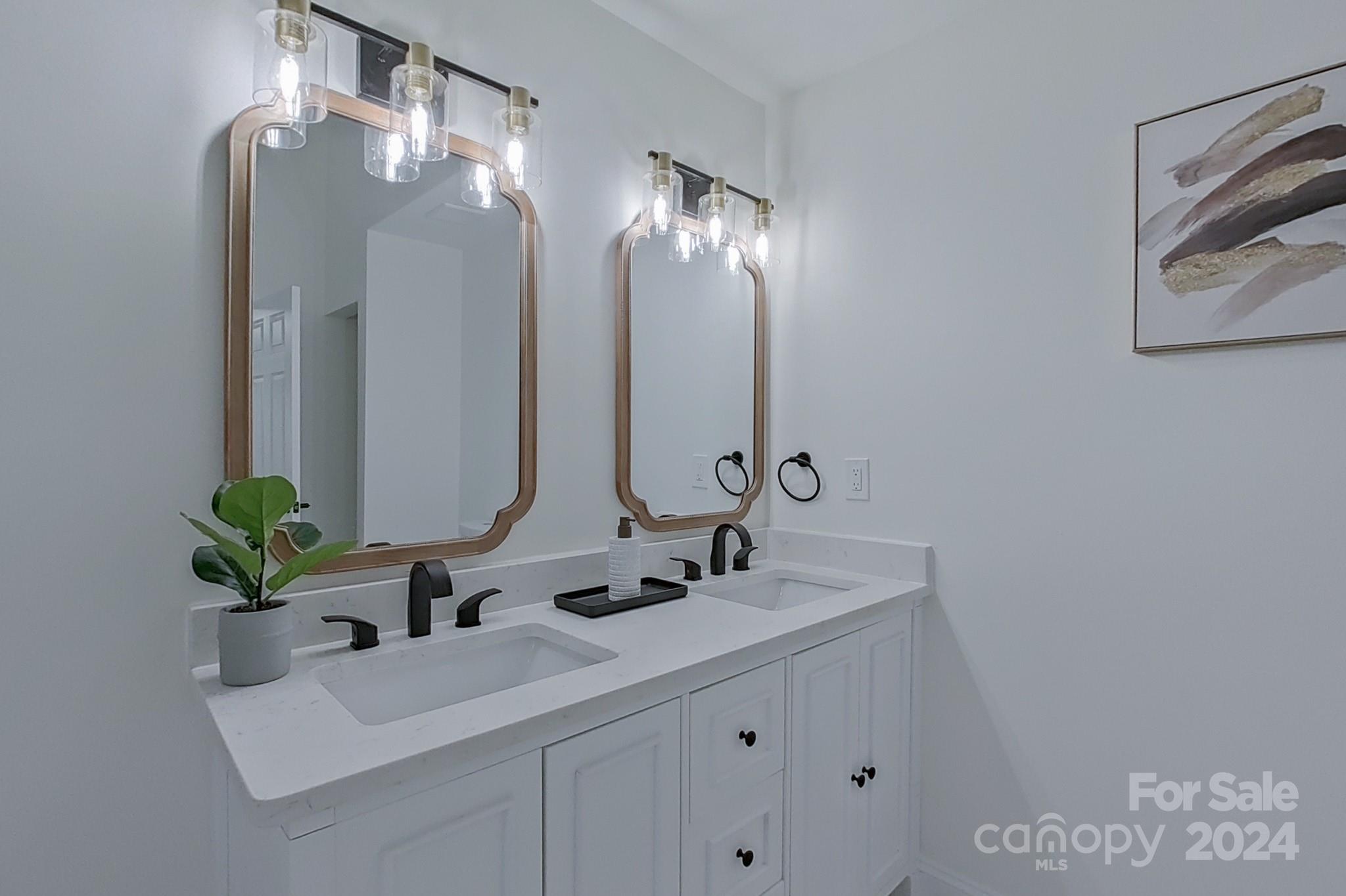 5710 Stream Ridge Drive Charlotte, NC 28269 - Photo 32 of 48 a bathroom with a sink and a mirror