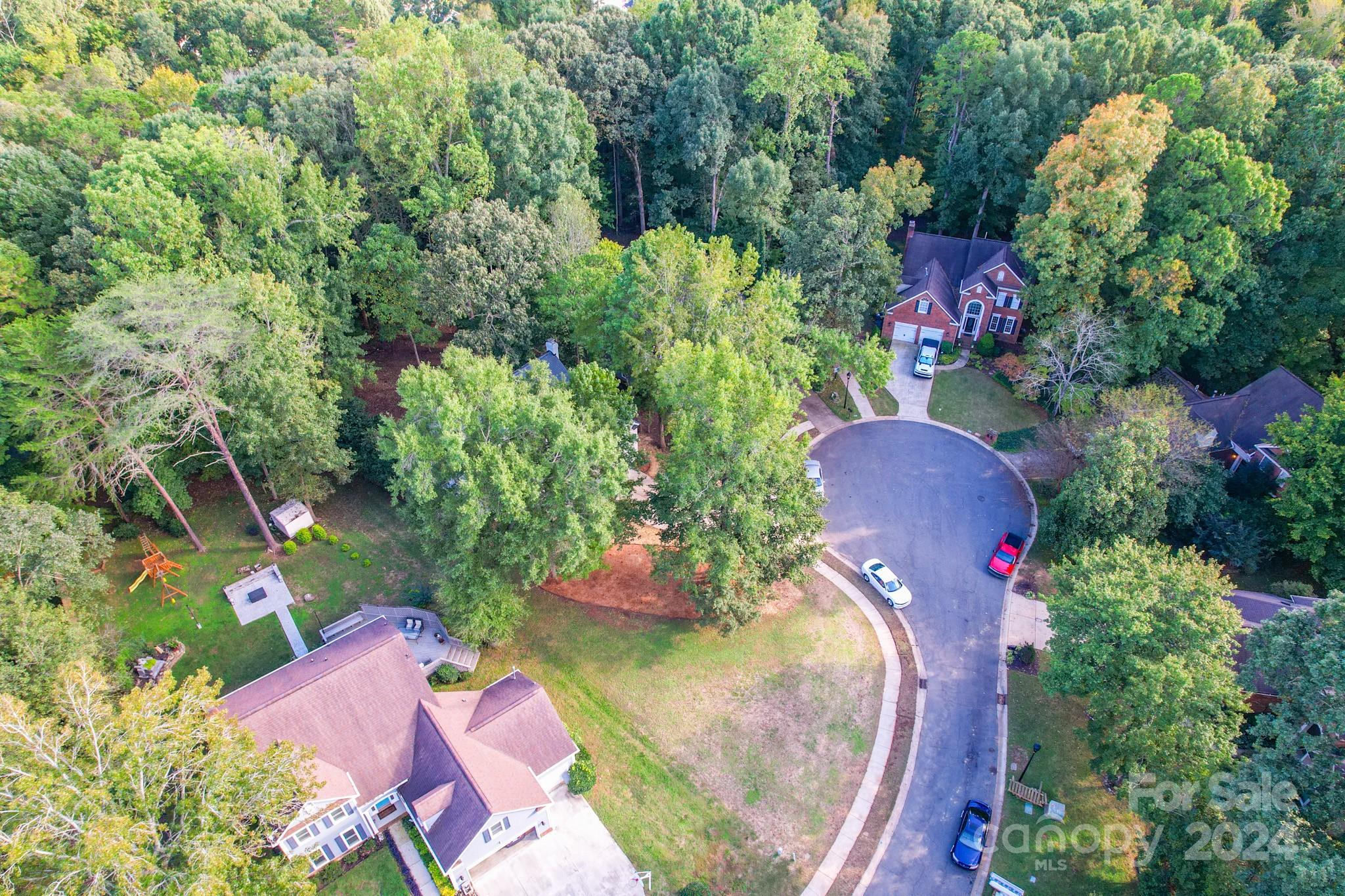 5710 Stream Ridge Drive Charlotte, NC 28269 - Photo 48 of 48 an aerial view of a house with a yard and fountain