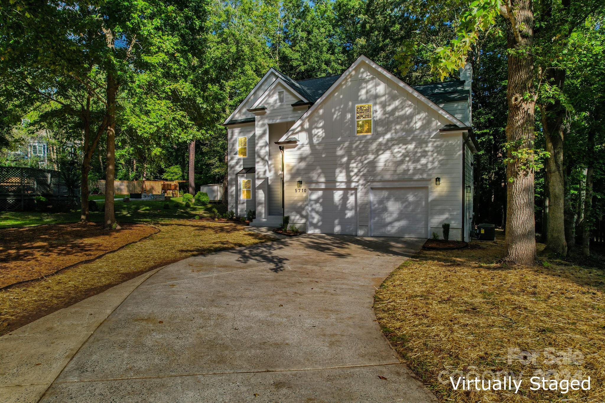 5710 Stream Ridge Drive Charlotte, NC 28269 - Photo 5 of 48 a view of a house with backyard and trees
