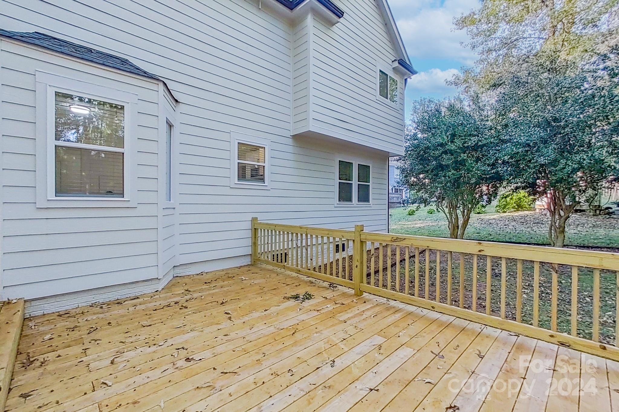 5710 Stream Ridge Drive Charlotte, NC 28269 - Photo 7 of 48 a view of a house with a wooden deck