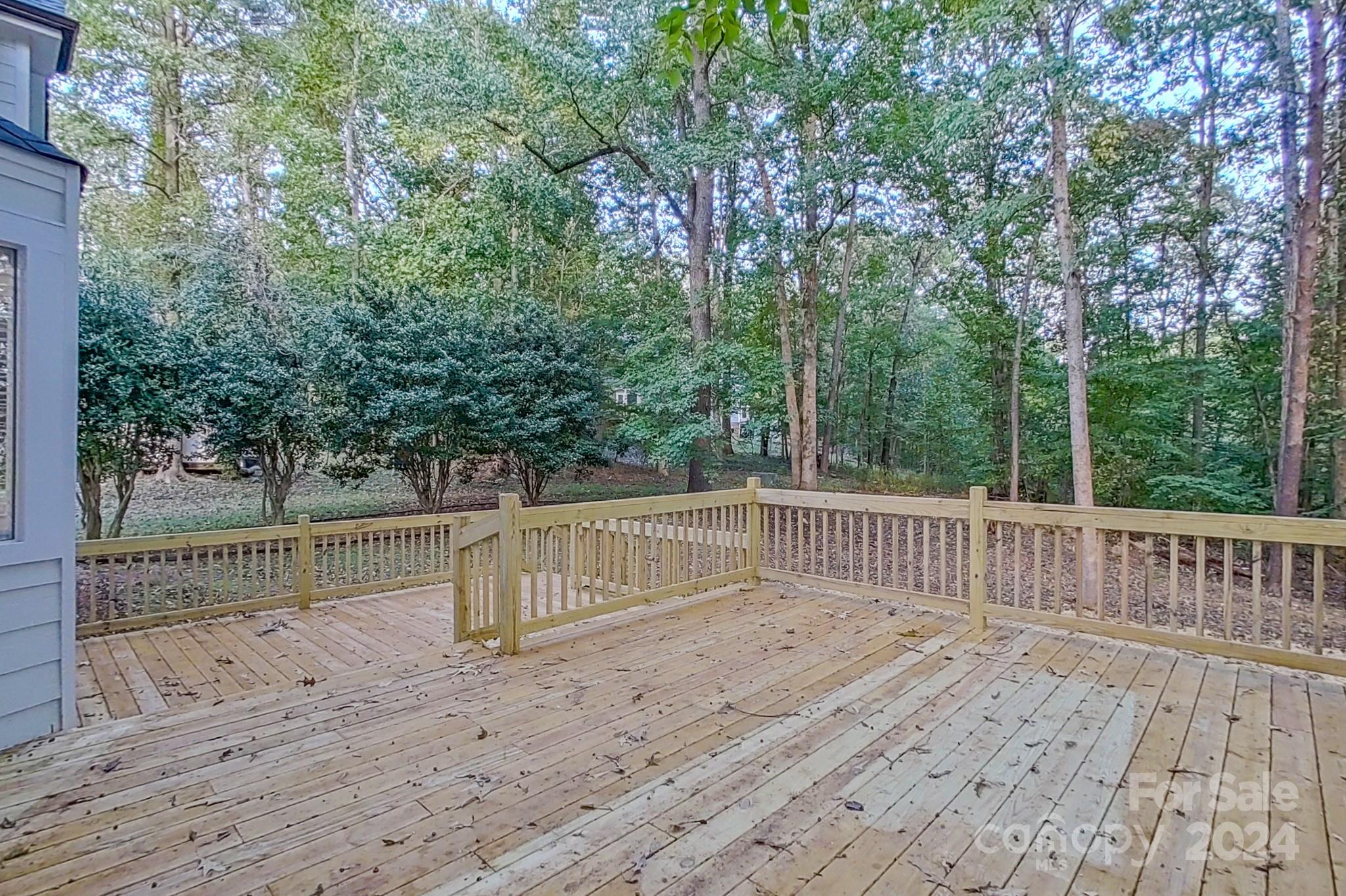 5710 Stream Ridge Drive Charlotte, NC 28269 - Photo 8 of 48 a view of a deck with a trees